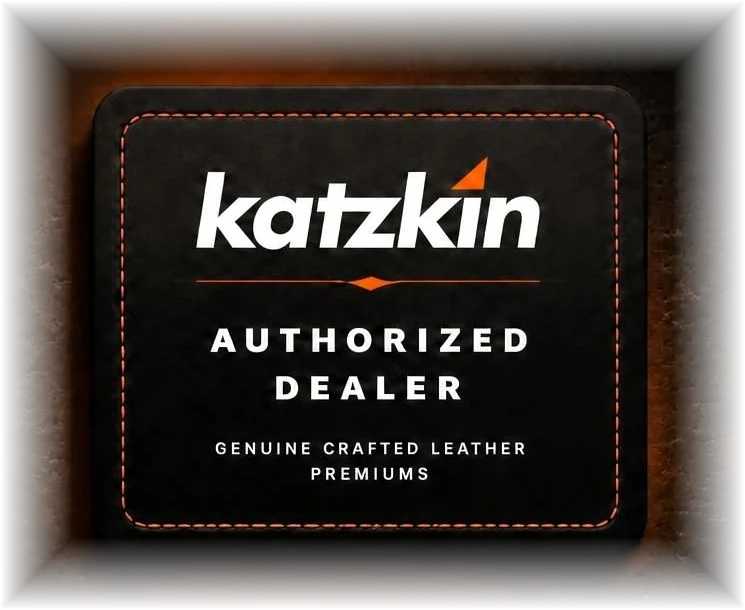 Katzkin Authorized Dealer badge in stitched black leather with brand orange accent
