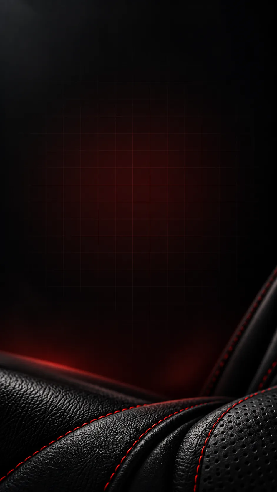 Black upholstery leather with red stitching beneath a red-lit grid